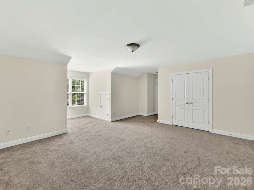 10507 Glenmeade Road, Cornelius, NC 28031.  MLS# CAR4391607, YatesRealty ID 30154. Expansive bonus room offers exceptional flexibility with ample space for a media room, playroom, home gym, office, or additional living area.