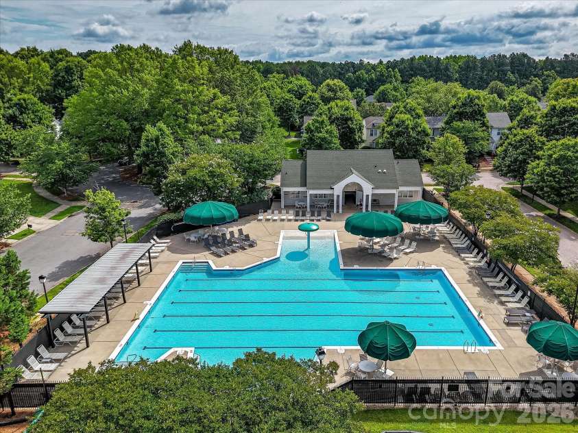10507 Glenmeade Road, Cornelius, NC 28031.  MLS# CAR4391607, YatesRealty ID 30154. Residents enjoy access to a beautifully maintained community pool complex with expansive sun deck seating, a playground, and gathering spaces designed for recreation and relaxation.