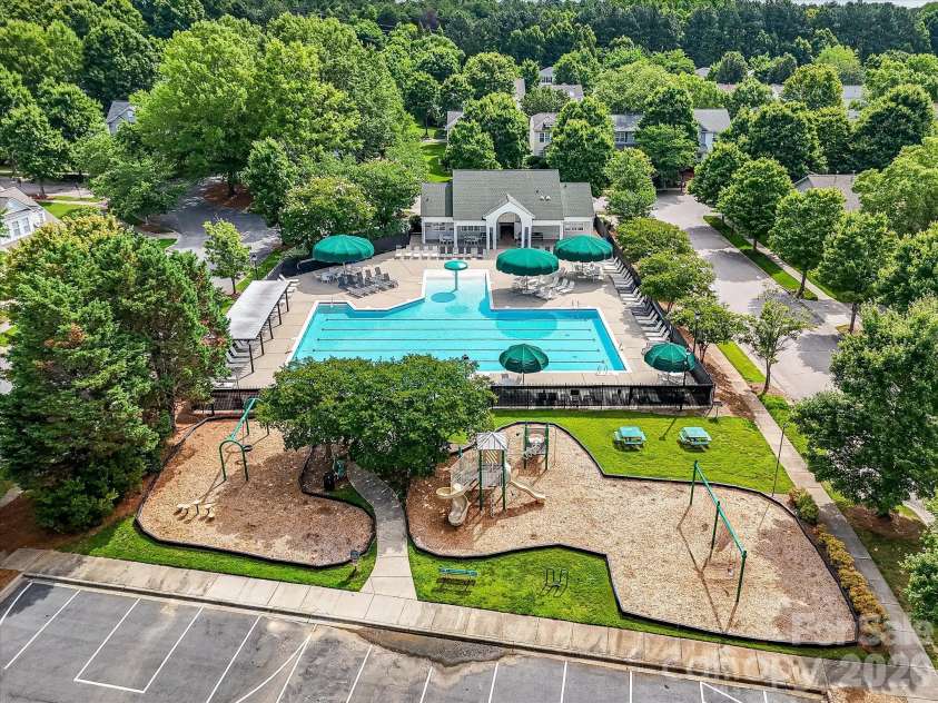 10507 Glenmeade Road, Cornelius, NC 28031.  MLS# CAR4391607, YatesRealty ID 30154. Residents enjoy access to a beautifully maintained community pool complex with expansive sun deck seating, a playground, and gathering spaces designed for recreation and relaxation.
