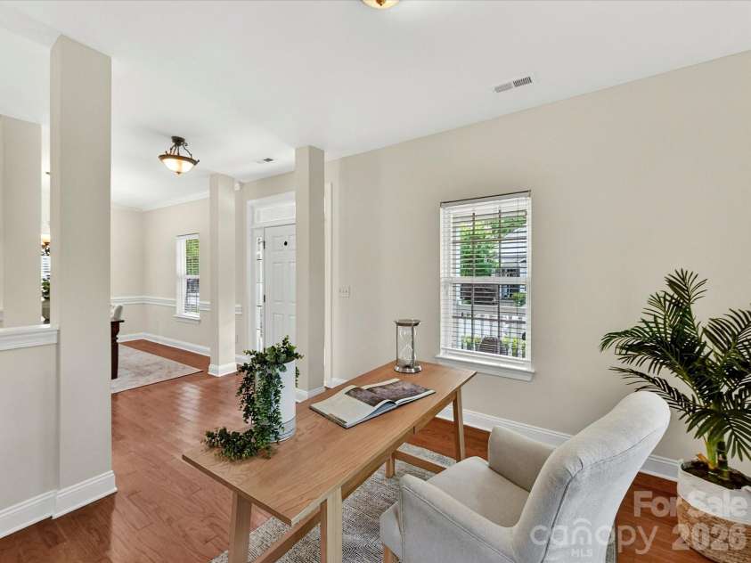 10507 Glenmeade Road, Cornelius, NC 28031.  MLS# CAR4391607, YatesRealty ID 30154. Versatile office or flex space features wood flooring, abundant natural light, and ample room for a home office, study, playroom, or additional living area.