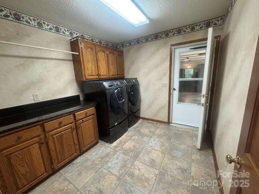 6339 River Front Drive, Harrisburg, NC 28075.  MLS# CAR4301925, YatesRealty ID 30155. Great size laundry room as you enter from garage with cabinets and folding area