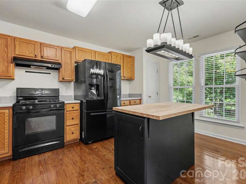 644 Sunset Point Drive, Rock Hill, SC 29732.  MLS# CAR4392650, YatesRealty ID 30156. Kitchen features a pantry and storage shelving