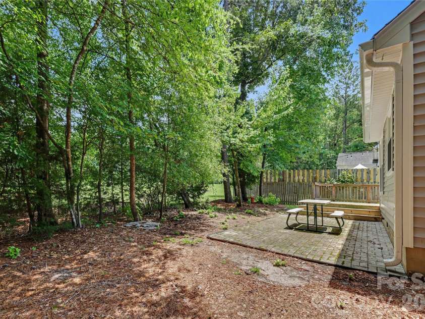 644 Sunset Point Drive, Rock Hill, SC 29732.  MLS# CAR4392650, YatesRealty ID 30156. Trees in the back yard and open space behind