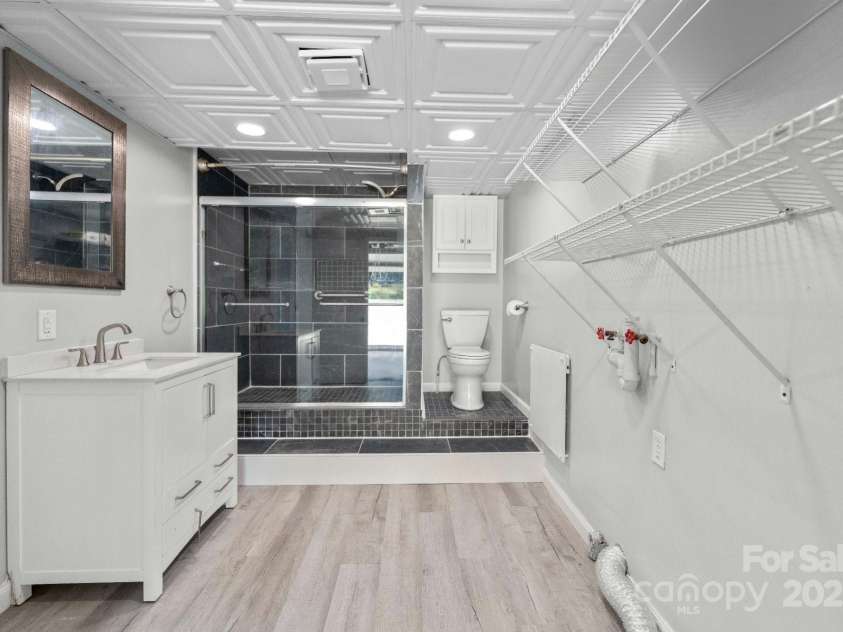 2011 Hampton Heights Street, Lenoir, NC 28645.  MLS# CAR4267552, YatesRealty ID 30159. Lower Bathroom