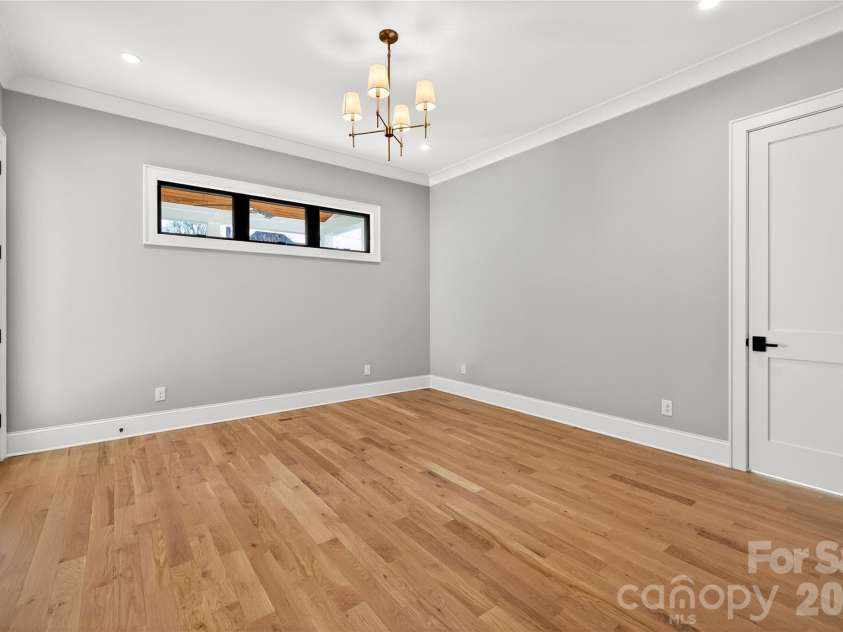 1316 Holmes Drive, Charlotte, NC 28209.  MLS# CAR4338664, YatesRealty ID 3016. Bedroom on Main Level of the home. Leads to the rear Porch. Door in photo is to the full bath that has a shower. There is an in-suite walk-in closet.