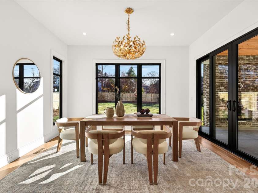 1316 Holmes Drive, Charlotte, NC 28209.  MLS# CAR4338664, YatesRealty ID 3016. Dining Room on the rear of the home off of the Kitchen. Overlooks the level back yard and the rear Porch. Beautiful lighting. 