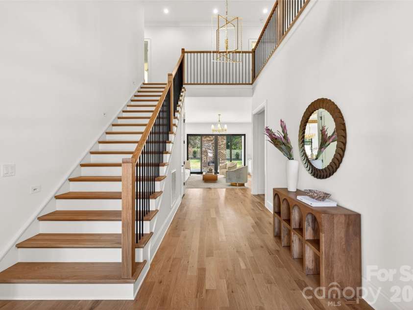 1316 Holmes Drive, Charlotte, NC 28209.  MLS# CAR4338664, YatesRealty ID 3016. Entry Hall with gorgeous banister. Floors are beautiful. Lighting, too! Very welcoming!