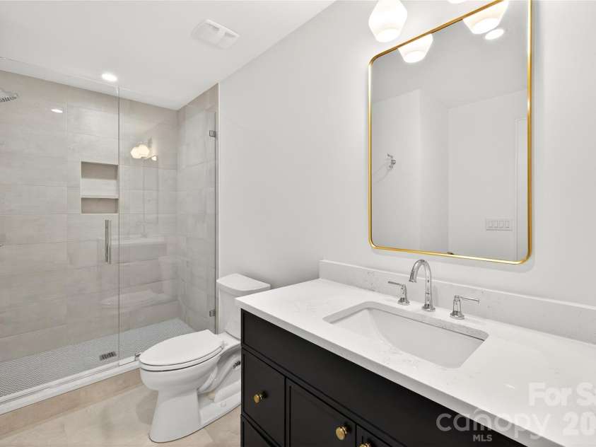 1316 Holmes Drive, Charlotte, NC 28209.  MLS# CAR4338664, YatesRealty ID 3016. In-suite Bathroom on 3rd Level. Rectangular mirror, 2-light light fixture. Shower only.