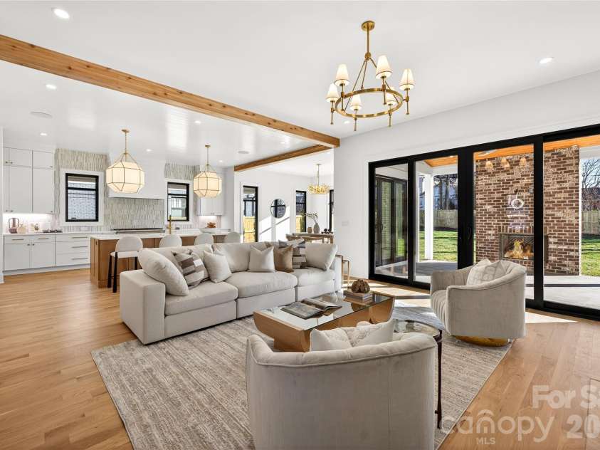 1316 Holmes Drive, Charlotte, NC 28209.  MLS# CAR4338664, YatesRealty ID 3016. Living Room with Kitchen beyond. Glass doors open to Rear Porch. Gorgeous open space on Main Level!