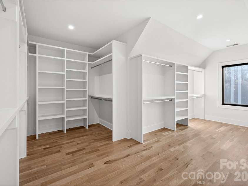 1316 Holmes Drive, Charlotte, NC 28209.  MLS# CAR4338664, YatesRealty ID 3016. Master Bedroom Walk-in Closet. Shelving for sweaters, shoes, shirts, suits, skirts, dresses and coats.