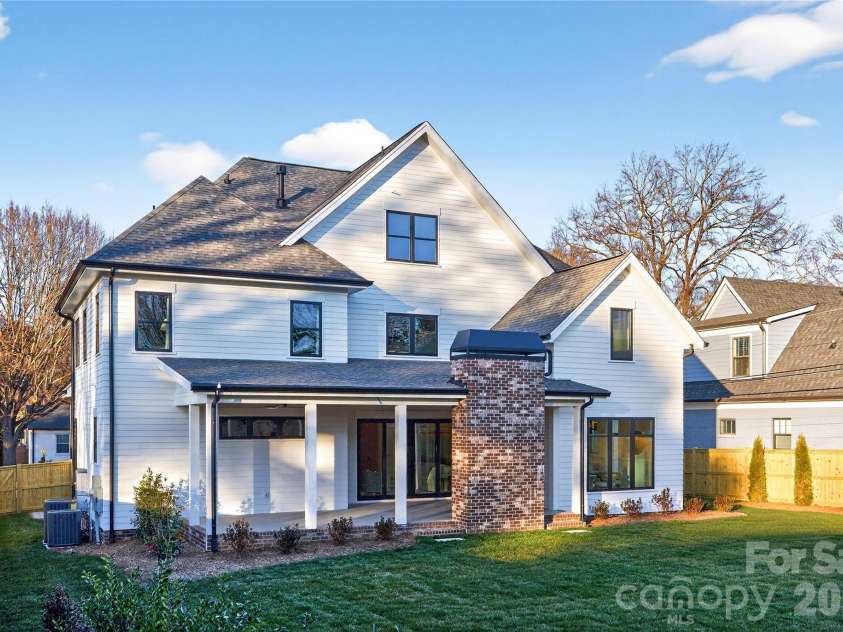 1316 Holmes Drive, Charlotte, NC 28209.  MLS# CAR4338664, YatesRealty ID 3016. View of rear Porch, gas log fireplace and plenty of space for outdoor dining! Level yard is perfect for badminton, volleyball or soccer. Would be a great yard if you wanted to put in a swimming pool. 