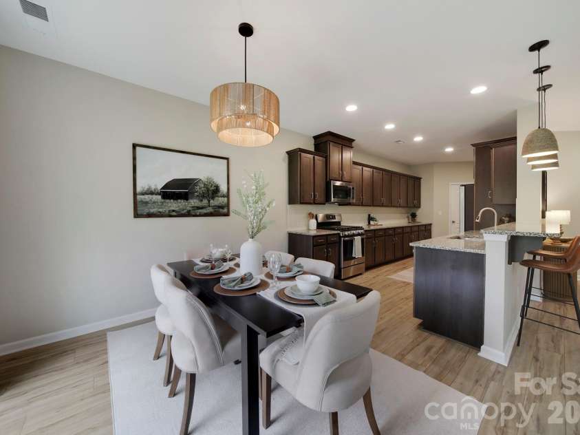 637 Amber Meadows Way, Tega Cay, SC 29708.  MLS# CAR4383765, YatesRealty ID 30162. Dining with Sliding Glass to Patio