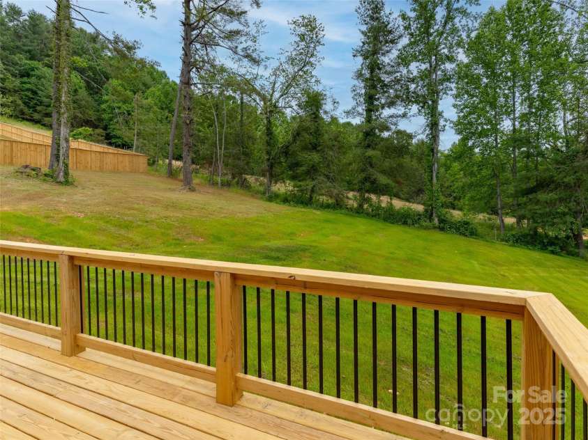 62 Smokey Quartz Lane, Flat Rock, NC 28731.  MLS# CAR4266289, YatesRealty ID 30175. Back deck over looking spacious back yard
