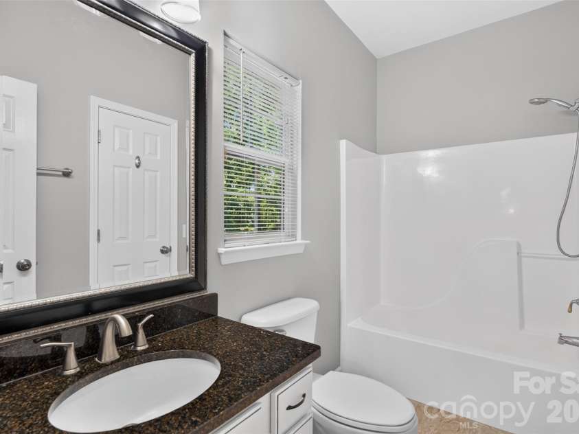 203 Elven Court, Waxhaw, NC 28173.  MLS# CAR4382799, YatesRealty ID 30186. Down stairs bathroom