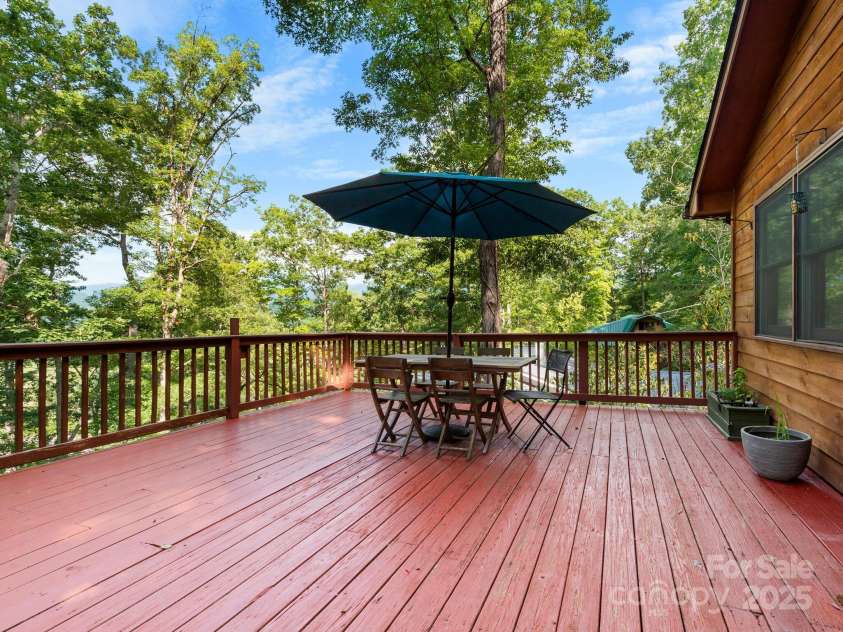 35 Essex Road, Waynesville, NC 28786.  MLS# CAR4280173, YatesRealty ID 30187. Expansive deck with mountain views