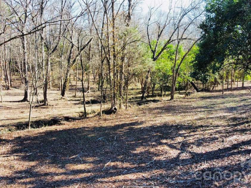 113 Stonecrest Circle, Concord, NC 28027.  MLS# CAR4337560, YatesRealty ID 3019. Small creek adds to the charm of this property