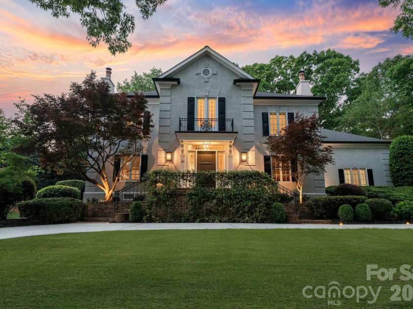 8124 Greencastle Drive, Charlotte, NC 28210.  MLS# CAR4364842, YatesRealty ID 30191. Front exterior view at twilight.