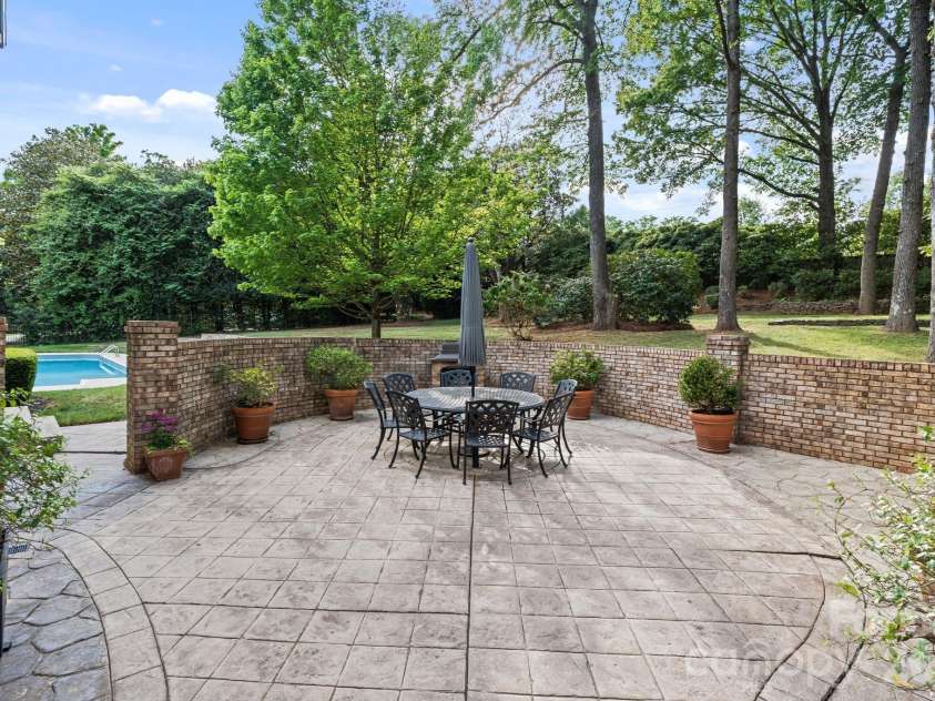 8124 Greencastle Drive, Charlotte, NC 28210.  MLS# CAR4364842, YatesRealty ID 30191. Outdoor dining patio. 