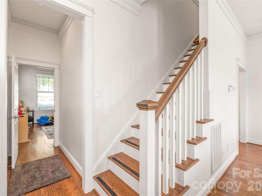 11543 Ardrey Crest Drive, Charlotte, NC 28277.  MLS# CAR4380693, YatesRealty ID 30194. Conveniently designed for optimal flow and function, a seamless pass-through connects the office/playroom to the main living area, leading toward the hardwood stairs tucked behind the living room.