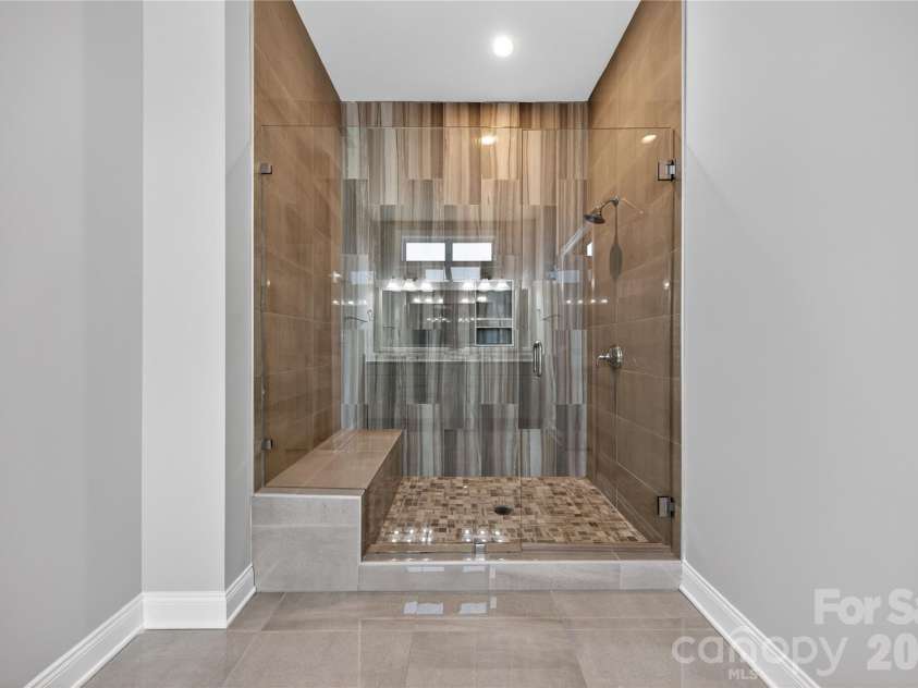 6044 Candlestick Lane, Lancaster, SC 29720.  MLS# CAR4385594, YatesRealty ID 30198. Glass Enclosed Tile Shower with Bench