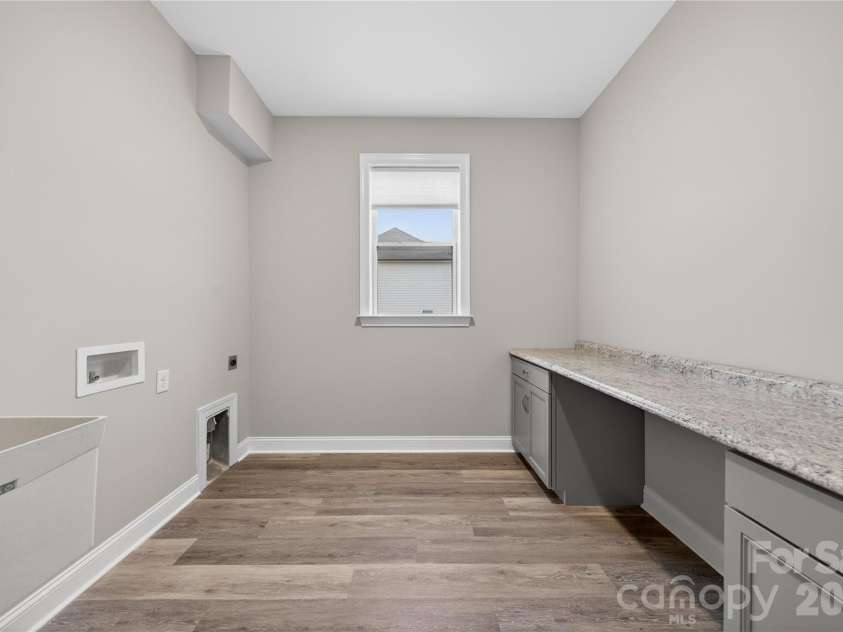 6044 Candlestick Lane, Lancaster, SC 29720.  MLS# CAR4385594, YatesRealty ID 30198. Laundry Room with Sink & Folding Table