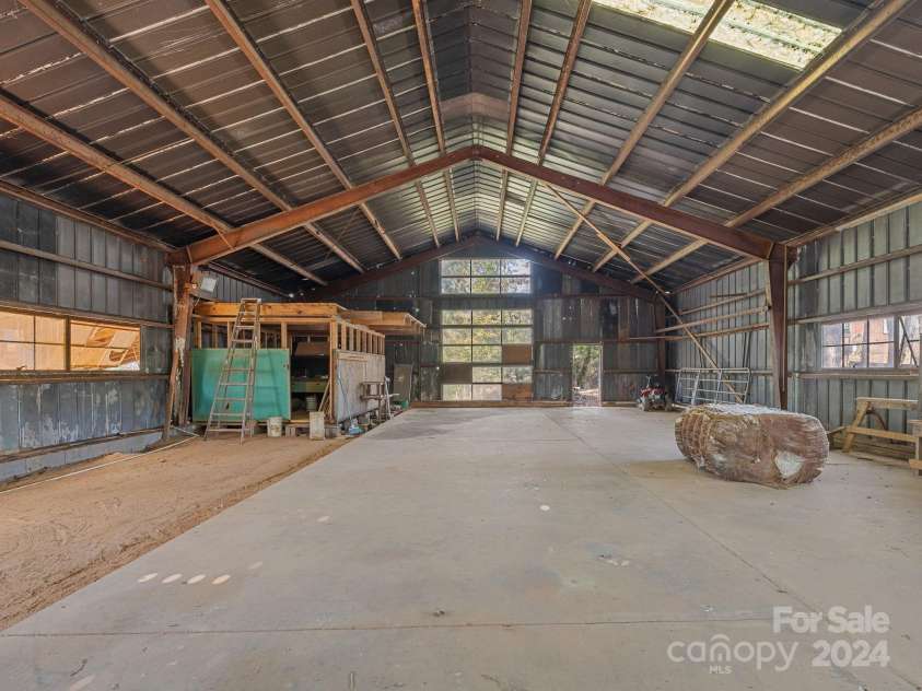 152 Long Branch Road, Chesnee, SC 29323.  MLS# CAR4204540, YatesRealty ID 302. 40x62 metal frame building with ample natural light could serve many purposes.  While most of the floor is concreted, there is a section of dirt along the side that could be useful for animals.