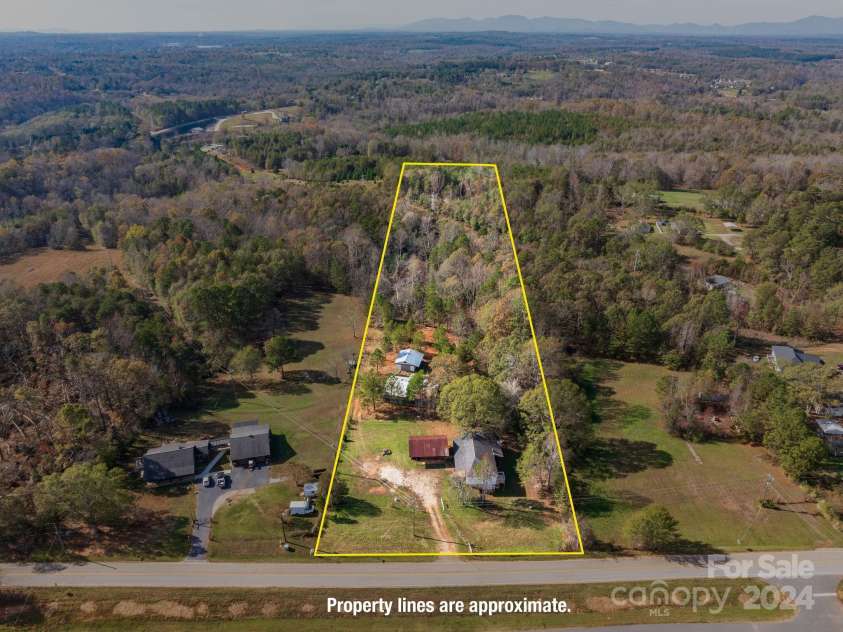 152 Long Branch Road, Chesnee, SC 29323.  MLS# CAR4204540, YatesRealty ID 302. Property is long and deep, offering privacy at the rear of the lot.There is a power line at the far end that transects the back acreage.