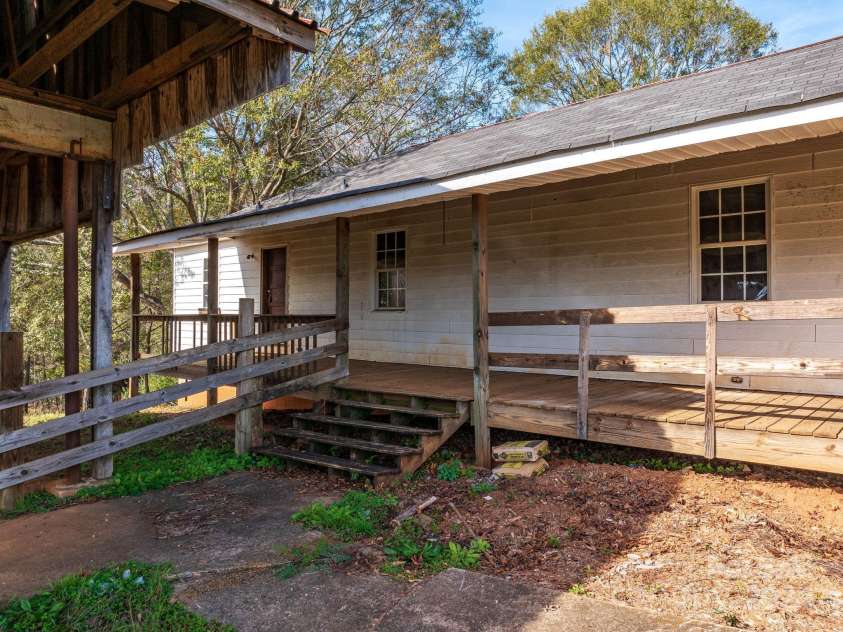 152 Long Branch Road, Chesnee, SC 29323.  MLS# CAR4204540, YatesRealty ID 302. Residence has an expansive covered porch and two front entrance doors.