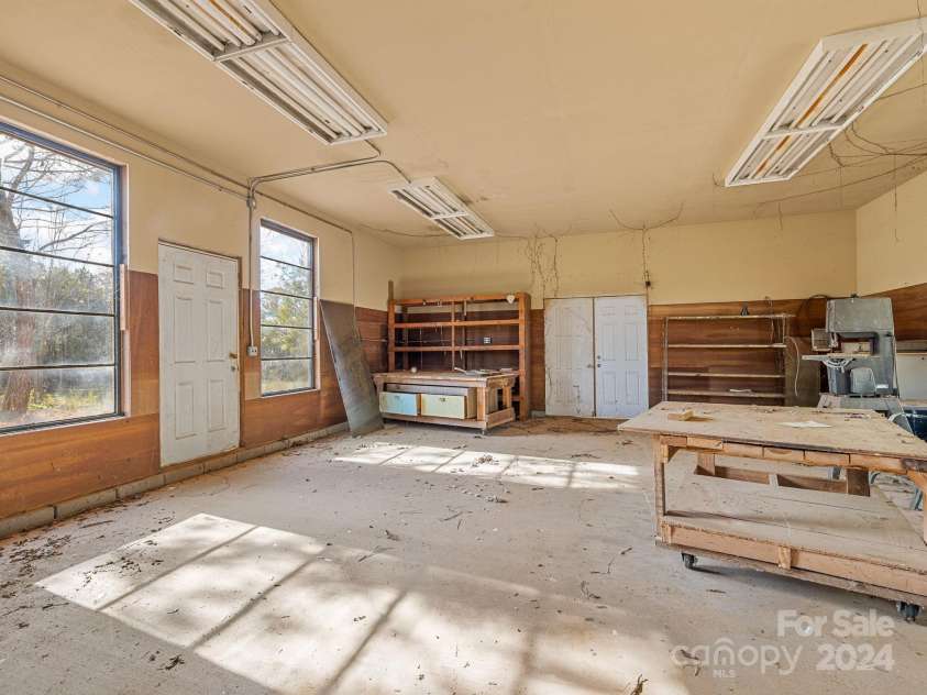 152 Long Branch Road, Chesnee, SC 29323.  MLS# CAR4204540, YatesRealty ID 302. This 24x30 workshop has drywall and ample natural light and was previously wired for electric. 