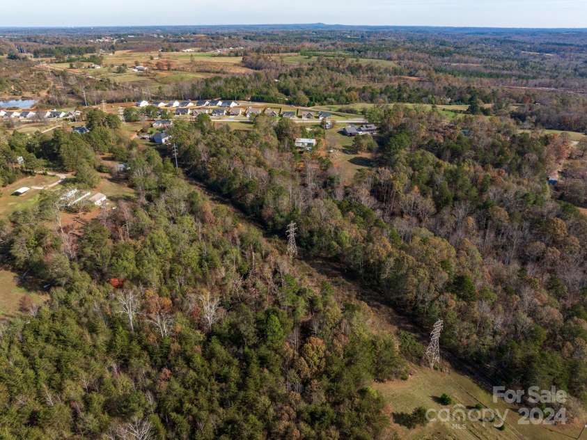 152 Long Branch Road, Chesnee, SC 29323.  MLS# CAR4204540, YatesRealty ID 302. This power line runs through the far back acreage of the long, narrow lot.