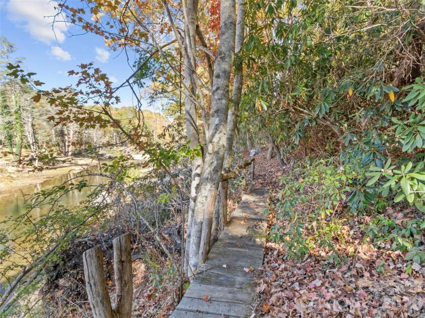 996 HALLS CHAPEL Road, Burnsville, NC 28714.  MLS# CAR4314014, YatesRealty ID 302. Bridge going to shed