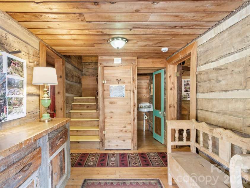 996 HALLS CHAPEL Road, Burnsville, NC 28714.  MLS# CAR4314014, YatesRealty ID 302. Foyer from porch