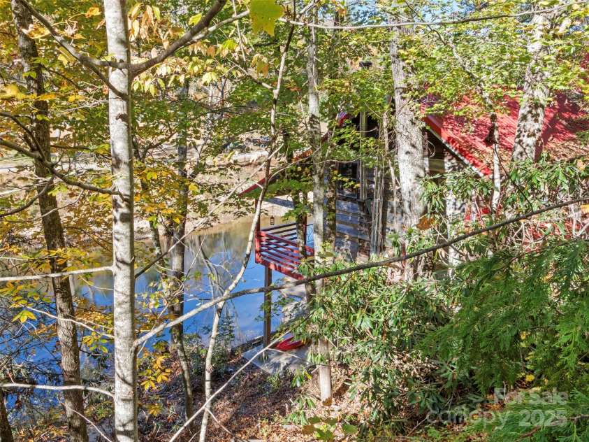 996 Halls Chapel Road, Burnsville, NC 28714.  MLS# CAR4314014, YatesRealty ID 302. Riverside cabin