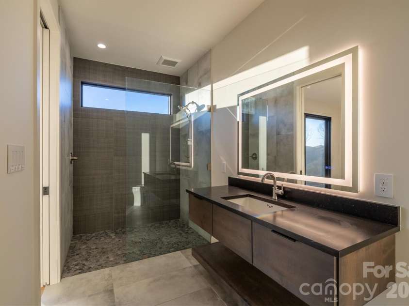 463 Summit Trail, Nebo, NC 28761.  MLS# CAR4350199, YatesRealty ID 3021. Ensuite baths for each lower level bedroom
