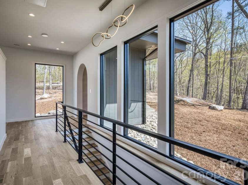 463 Summit Trail, Nebo, NC 28761.  MLS# CAR4350199, YatesRealty ID 3021. Front hallway to primary bedroom
