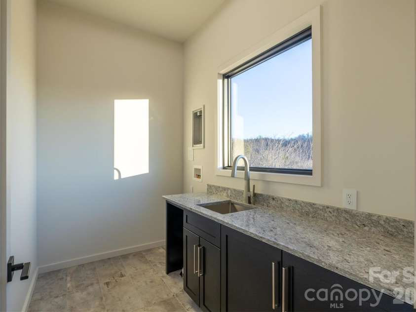 463 Summit Trail, Nebo, NC 28761.  MLS# CAR4350199, YatesRealty ID 3021. Laundry in lower level