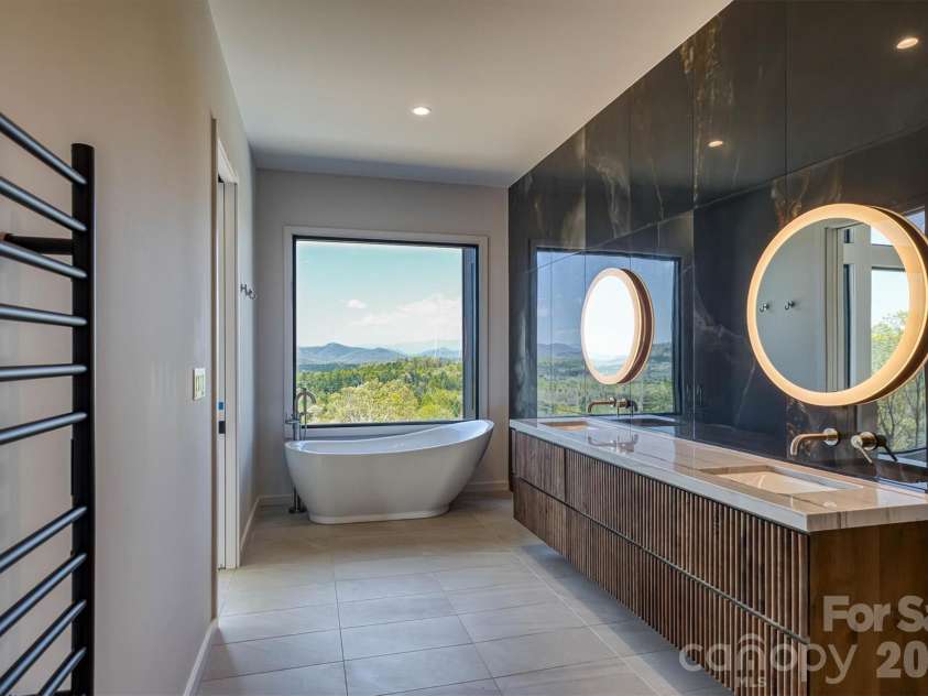 463 Summit Trail, Nebo, NC 28761.  MLS# CAR4350199, YatesRealty ID 3021. Primary bath has double sinks and soaking tub