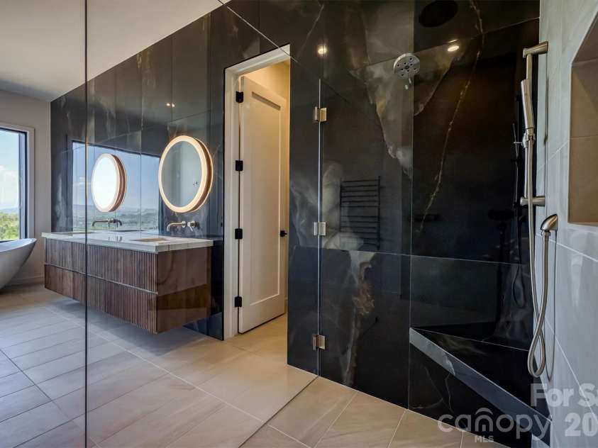 463 Summit Trail, Nebo, NC 28761.  MLS# CAR4350199, YatesRealty ID 3021. Primary bath with zero entry shower