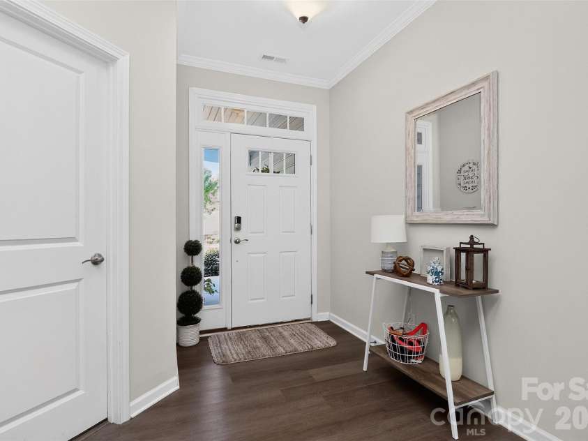773 River Park Road, Belmont, NC 28012.  MLS# CAR4391220, YatesRealty ID 30213. A Bright First Impression. Natural light pours through the transom and sidelight windows, creating a warm, welcoming foyer that sets the tone for the beautiful spaces beyond.