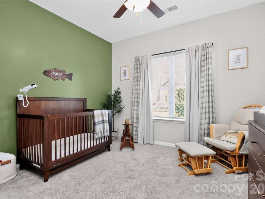 773 River Park Road, Belmont, NC 28012.  MLS# CAR4391220, YatesRealty ID 30213. A Comfortable Space to Recharge. Soft natural light, neutral finishes, and a ceiling fan create a welcoming bedroom that's ready to fit your lifestyle.