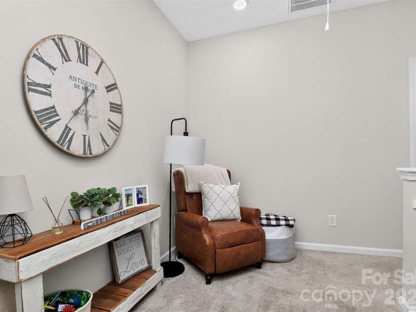 773 River Park Road, Belmont, NC 28012.  MLS# CAR4391220, YatesRealty ID 30213. A Little Extra Goes a Long Way. Whether you envision a quiet reading corner, study space, or media nook, this charming loft offers endless possibilities.