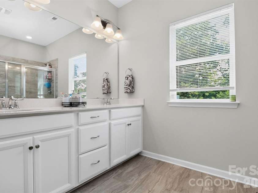 773 River Park Road, Belmont, NC 28012.  MLS# CAR4391220, YatesRealty ID 30213. Designed with Everyday Comfort in Mind. The spacious primary en suite bath features a dual-sink vanity with generous counter space, providing both style and functionality for busy mornings and relaxing evenings.