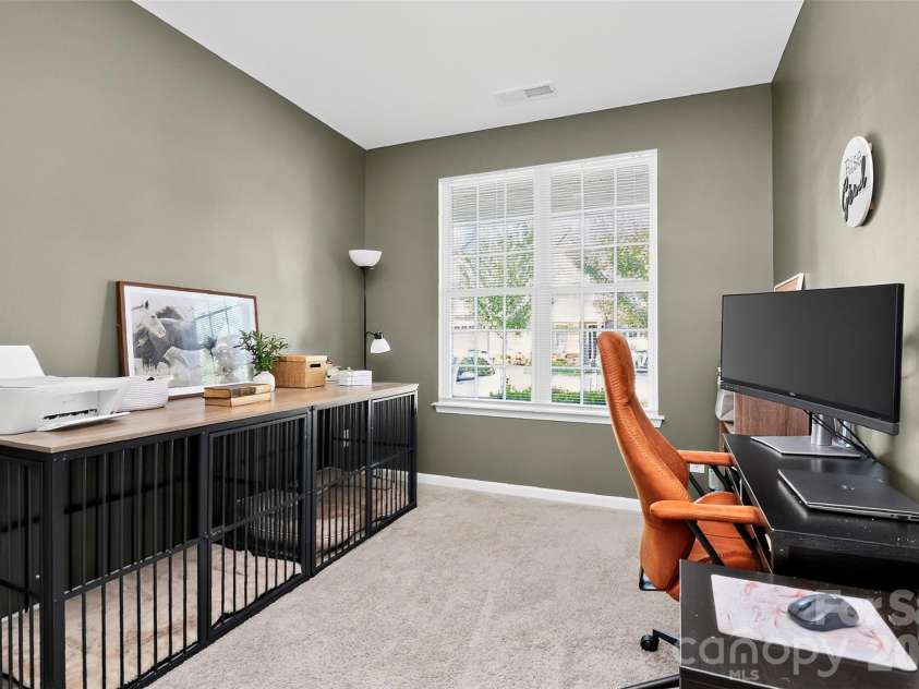 773 River Park Road, Belmont, NC 28012.  MLS# CAR4391220, YatesRealty ID 30213. Flexibility You Can Count On. Complete with a closet, this main-level room easily functions as a home office, fourth bedroom, exercise room, craft space, or den—whatever fits your lifestyle best.