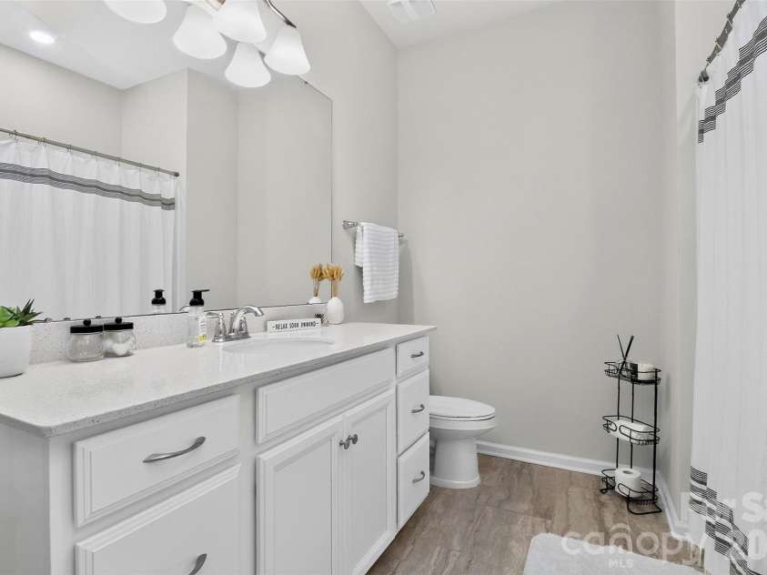 773 River Park Road, Belmont, NC 28012.  MLS# CAR4391220, YatesRealty ID 30213. Fresh, Functional, and Ready to Enjoy. This bright full bath serves the secondary bedrooms with a spacious vanity, ample storage, and classic finishes that never go out of style.