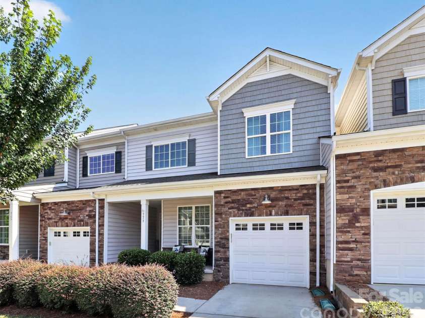 773 River Park Road, Belmont, NC 28012.  MLS# CAR4391220, YatesRealty ID 30213. Welcome Home! Thoughtfully designed with inviting curb appeal, a spacious front porch, and low-maintenance living—this beautiful townhome is your gateway to an incredible waterfront lifestyle.
