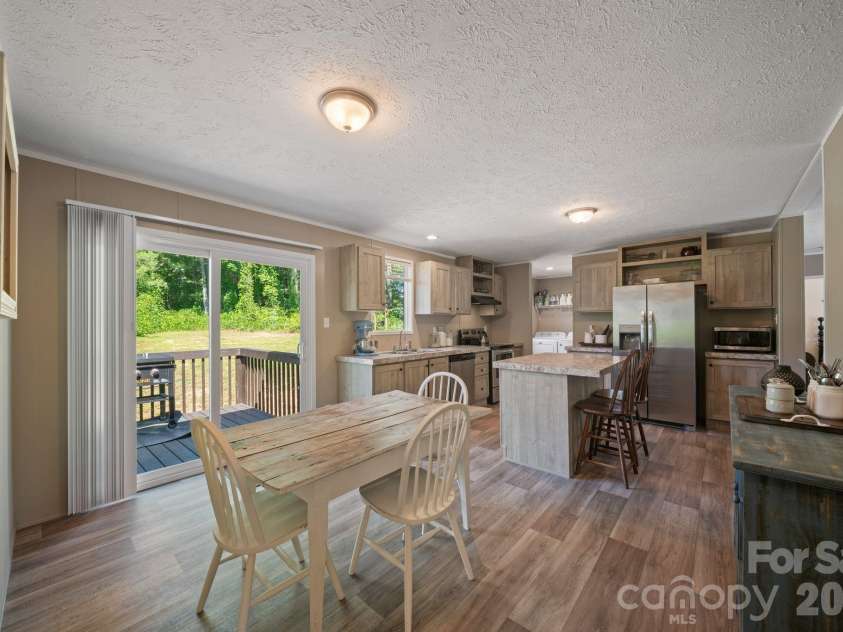 151 Field Sparrow Lane, Hendersonville, NC 28792.  MLS# CAR4388296, YatesRealty ID 30216. Dining Room + Kitchen