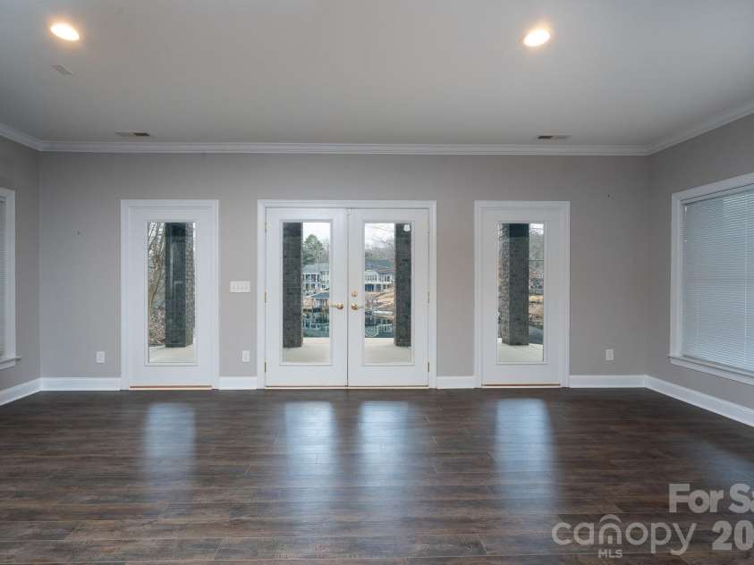 338 Plantation Way, Mount Gilead, NC 27306.  MLS# CAR4335615, YatesRealty ID 3022. Doors out to patio from basement living area.