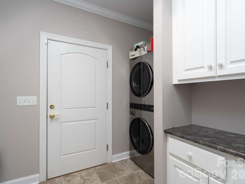 338 Plantation Way, Mount Gilead, NC 27306.  MLS# CAR4335615, YatesRealty ID 3022. Main Level Laundry and Door to Garage