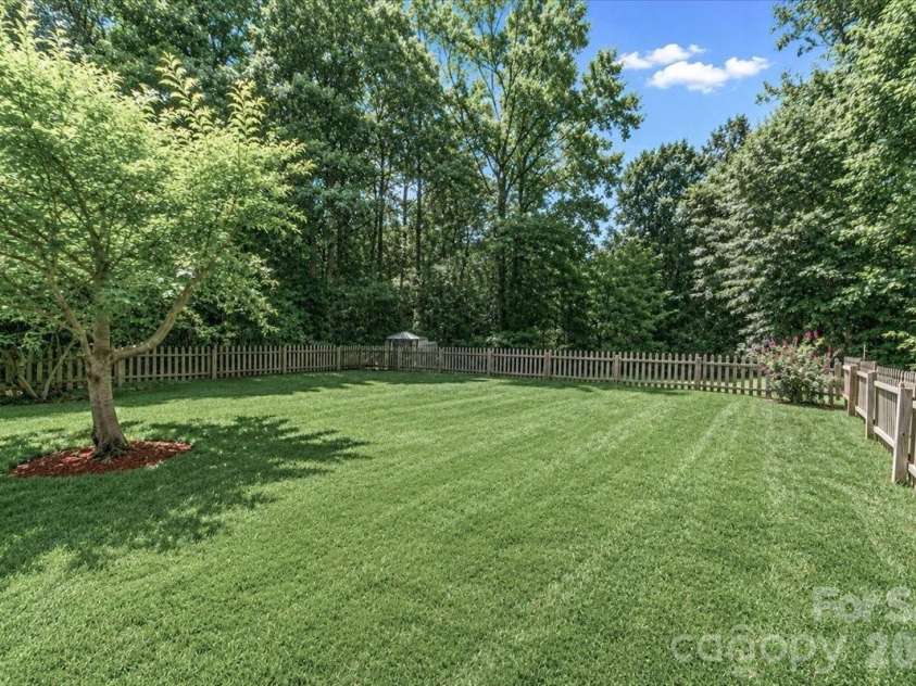 6803 Lowesville Lane, Stanley, NC 28164.  MLS# CAR4385358, YatesRealty ID 30226. Backyard