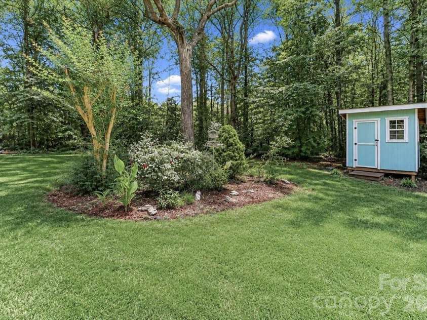 6803 Lowesville Lane, Stanley, NC 28164.  MLS# CAR4385358, YatesRealty ID 30226. Backyard with shed